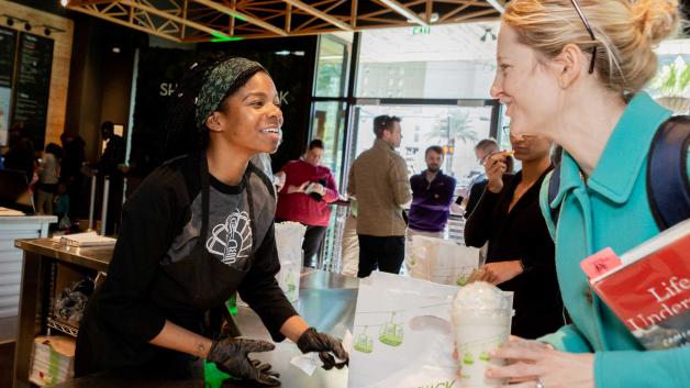 Shake Shack employee helping customer